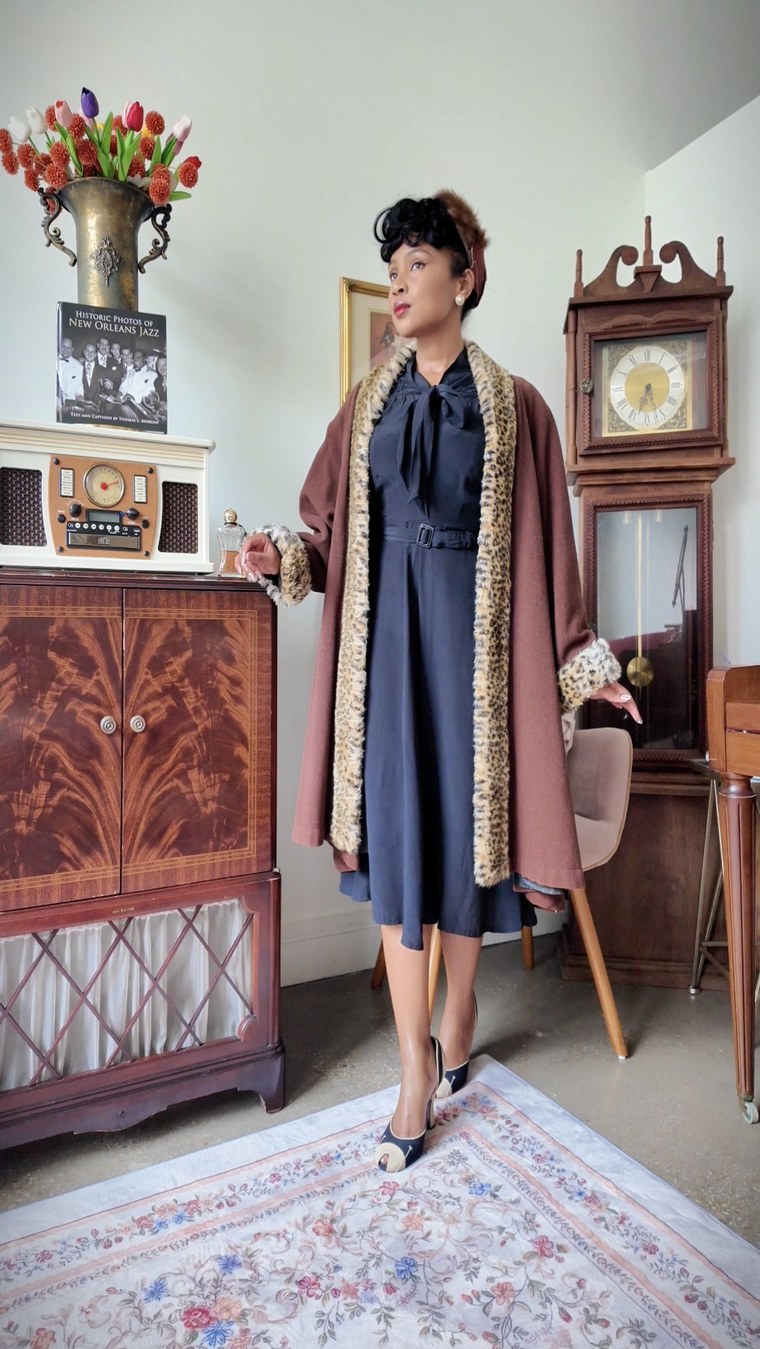 Navy dress with a leopard-trim coat